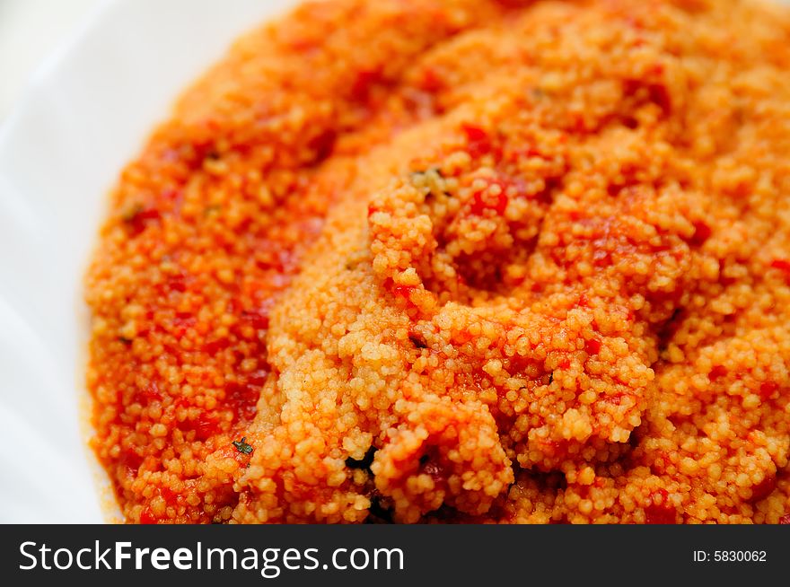 Cous cous with tomato sauce and little basil. Cous cous with tomato sauce and little basil.