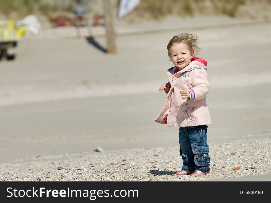 Cute young girl having fun on the beach. Cute young girl having fun on the beach