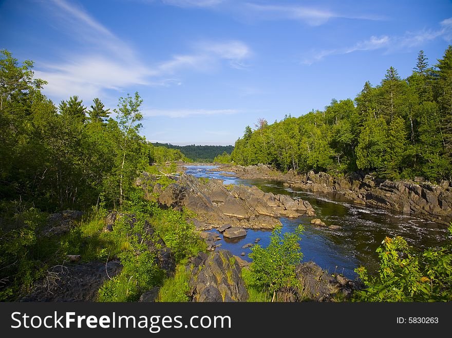 River and Stone Through the North Woods