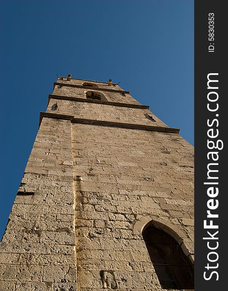 Medieval tower soaring into the blue sky