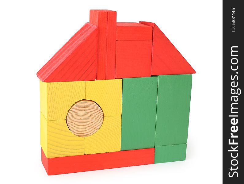 House from toy wooden cubes on white