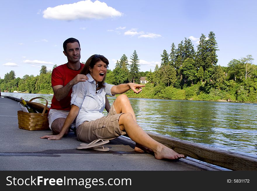 Couple Laughing by a Lake - Vertical