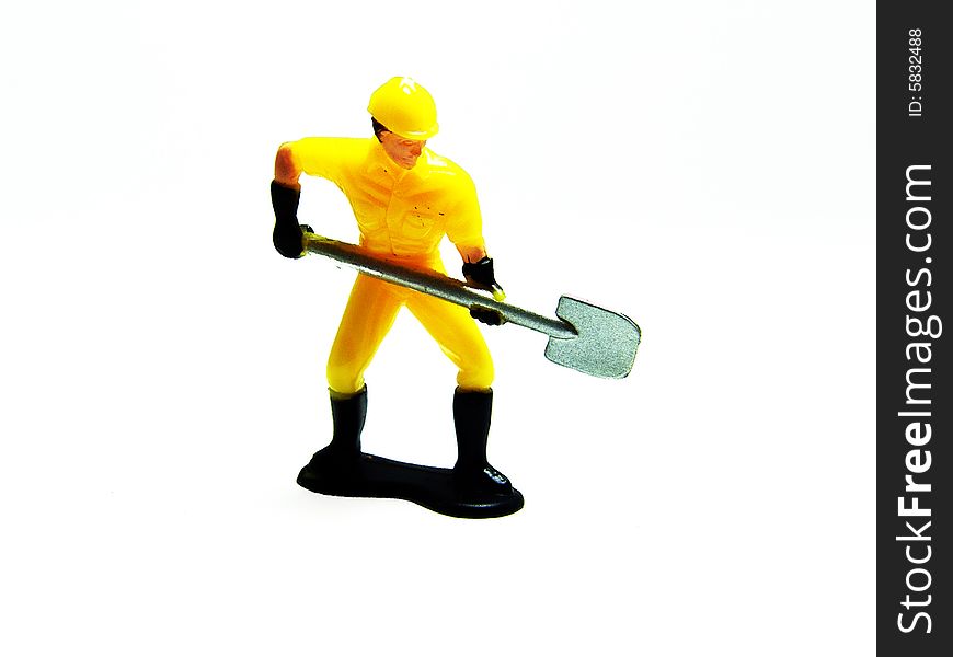Small toy featuring a construction worker in action