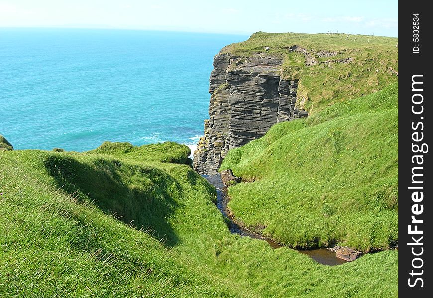 A green cliff on the west coast of Ireland county Clare. A green cliff on the west coast of Ireland county Clare.