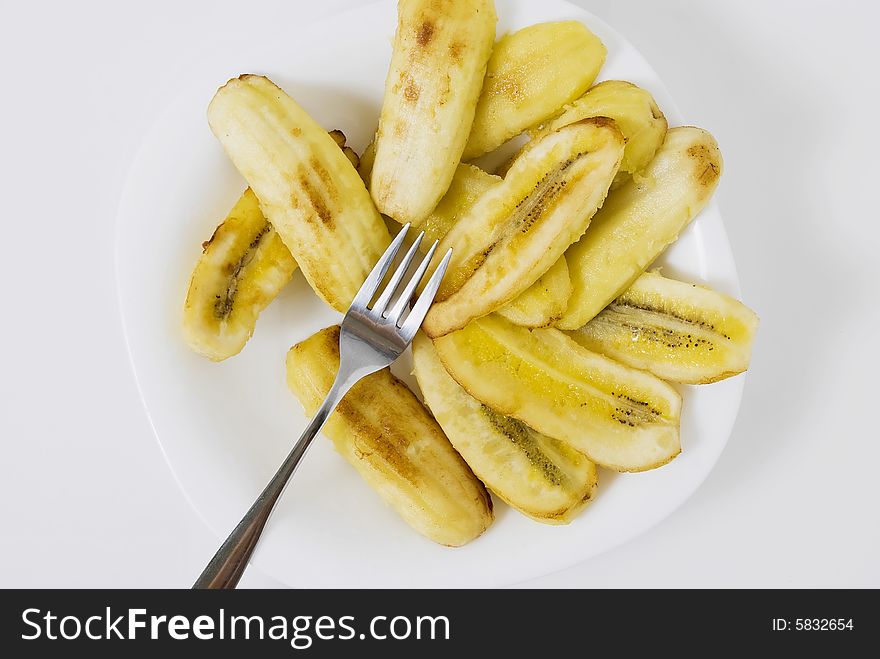 Sliced bananas sprinkled with brown sugar, then fried. Sliced bananas sprinkled with brown sugar, then fried