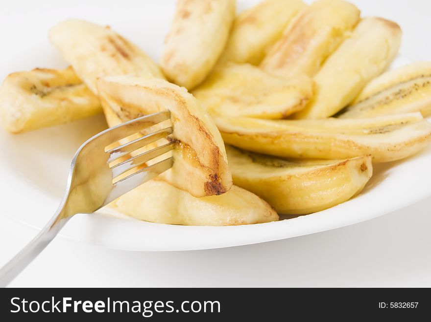 Sliced bananas sprinkled with brown sugar, then fried. Sliced bananas sprinkled with brown sugar, then fried