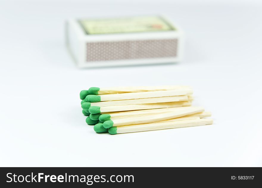 Green wooden matches over box