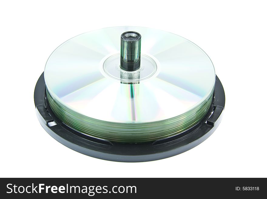 Colorful DVDs or CDs on spindle, on white background. No dust. Colorful DVDs or CDs on spindle, on white background. No dust.