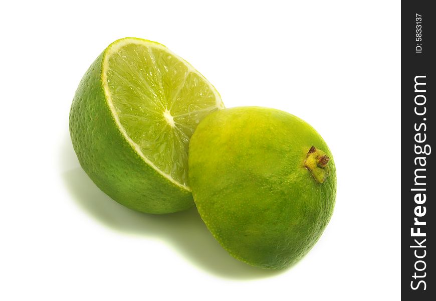 A fresh cut apart lime isolated on white background
