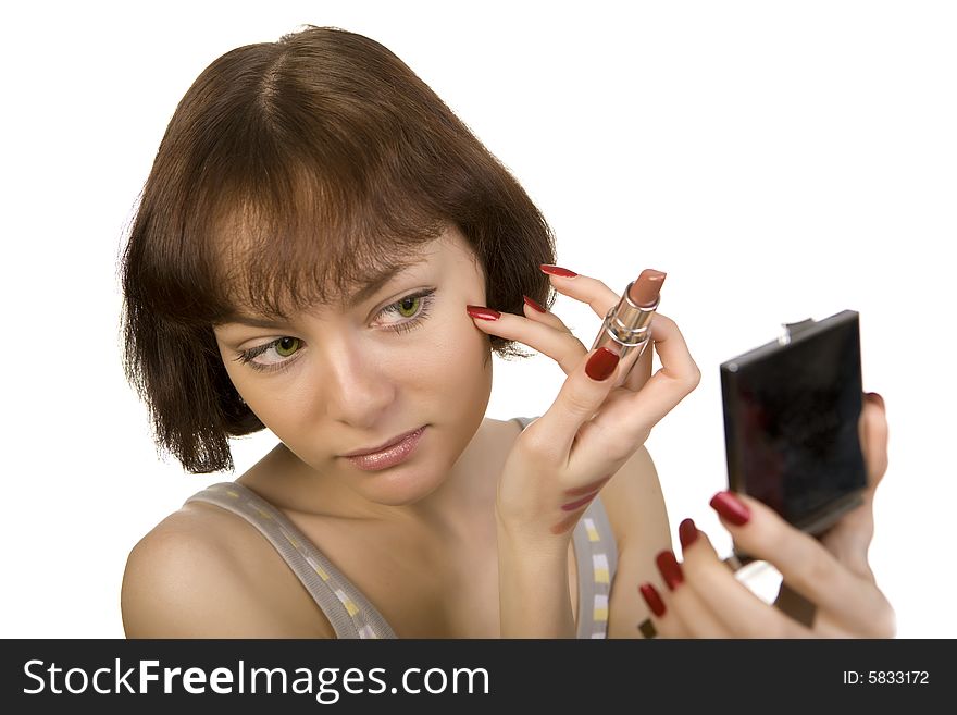 A photo of a young girl make herself up. A photo of a young girl make herself up