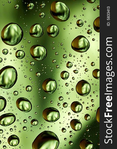 Green water drops spots background
