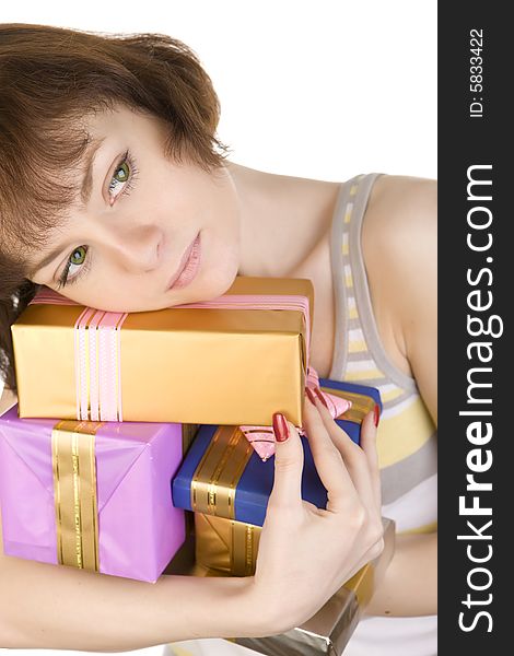 A close- up of sad girl with gifts over white