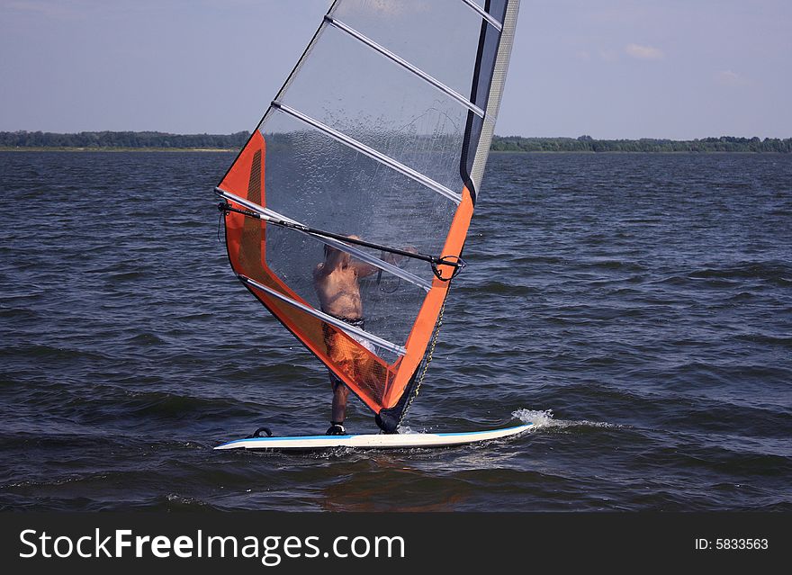 Windsurfer on the river in the summer