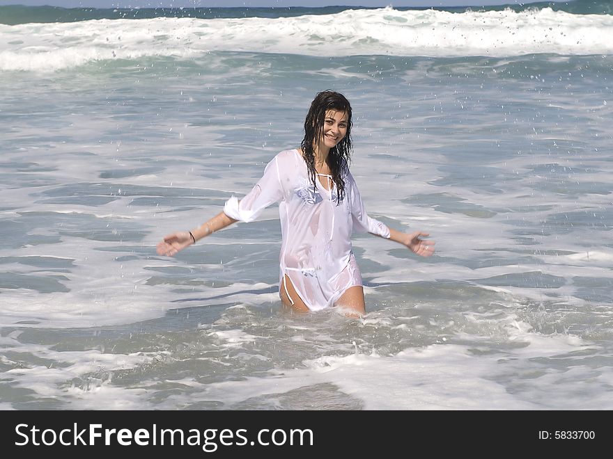 Woman In The Seaside Playing And Laughing