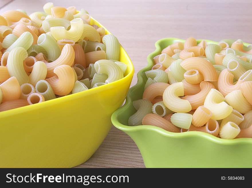 Two bowls  full  of Macaroni. Two bowls  full  of Macaroni