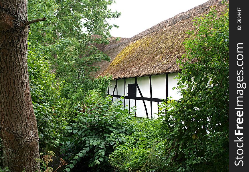 Typical Old Style Country farmhouse thatched straw roof Denmark. Typical Old Style Country farmhouse thatched straw roof Denmark