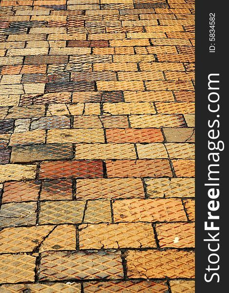 Pedestrian brick pavement in different colors with a pattern on top