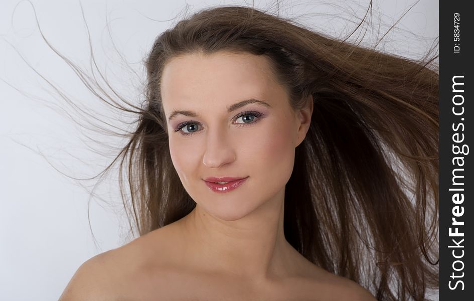 Close-up portrait of beautiful woman with professional makeup.