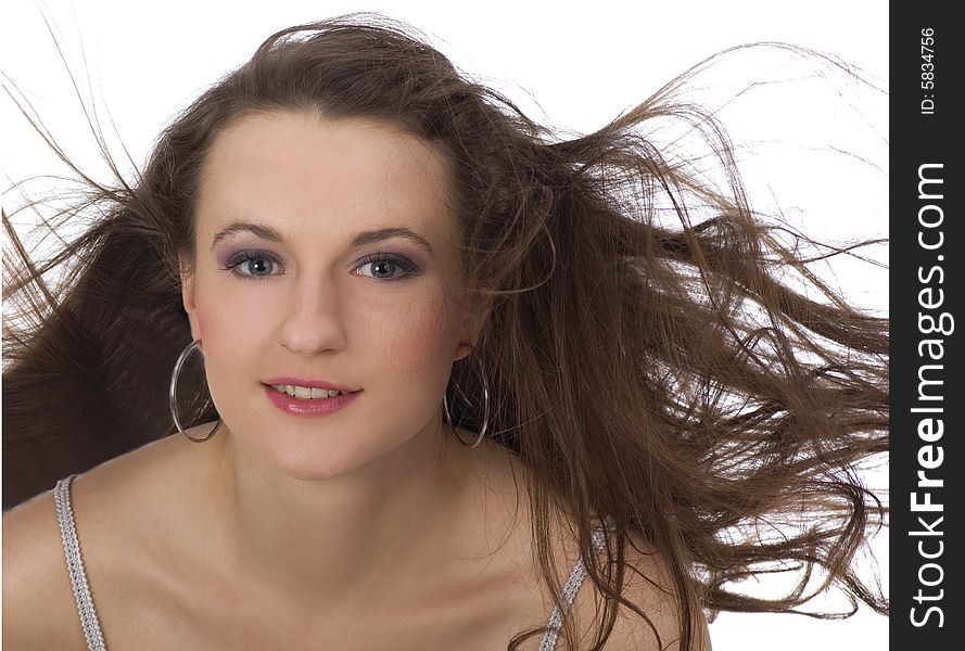 Close-up portrait of beautiful woman with professional makeup.