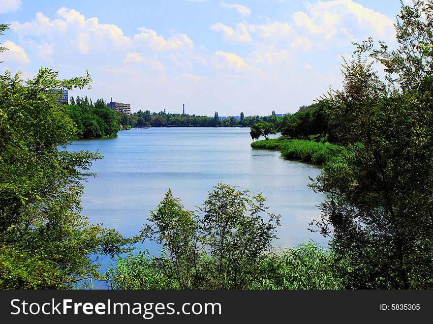 City park, lake in large town, blue sky, magnificent weather, glad mood, green belt of rest, quiet corner of nature, island of wild nature, defence of environment, clean ecology, kind on a lake, days off, hike on fishing,