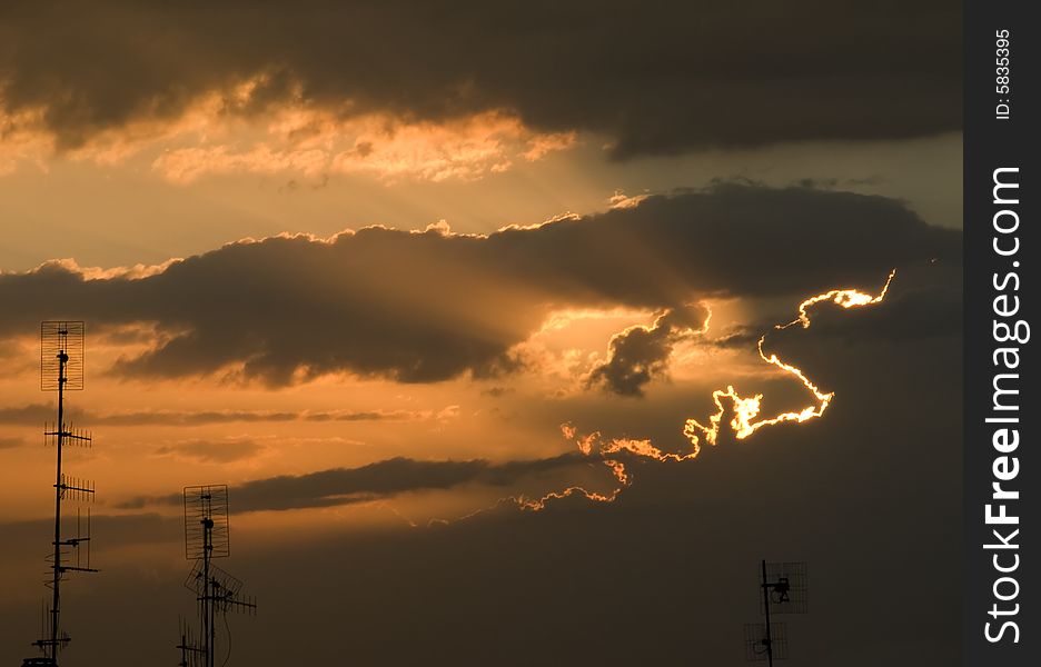 Antennas against sunset sky with clouds. Antennas against sunset sky with clouds