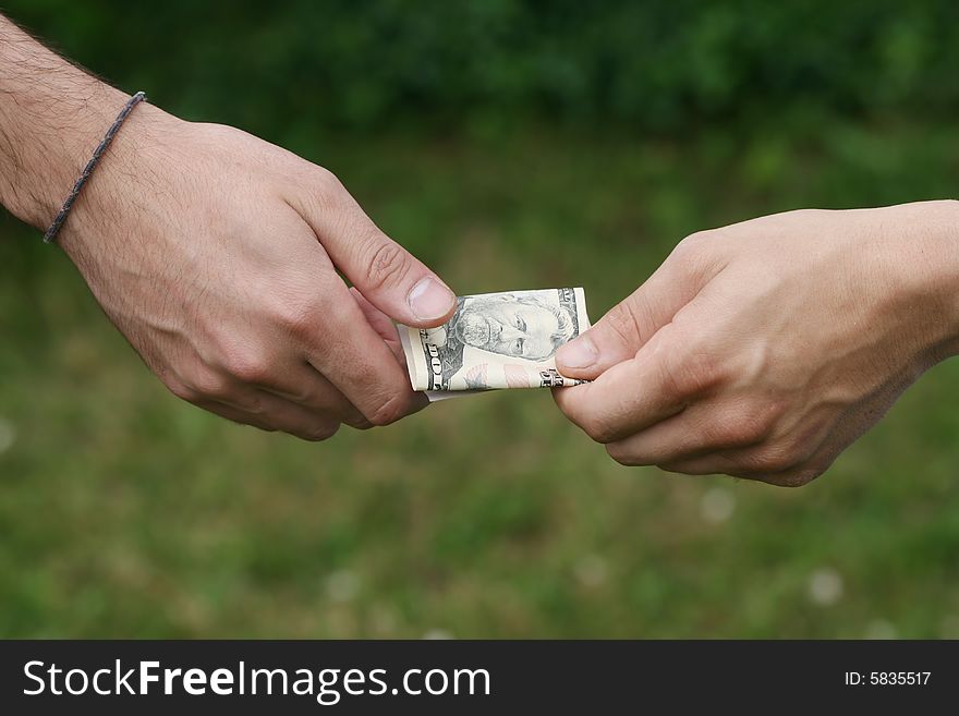 Payout with fifty dollars between two men. Payout with fifty dollars between two men