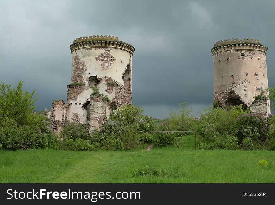 Ancient towers on the dark sky - ruins of strong castle in Chervonograd (Ukraine). Ancient towers on the dark sky - ruins of strong castle in Chervonograd (Ukraine)