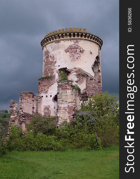 Ancient tower on the dark sky - ruins of strong castle in Chervonograd (Ukraine). Ancient tower on the dark sky - ruins of strong castle in Chervonograd (Ukraine)