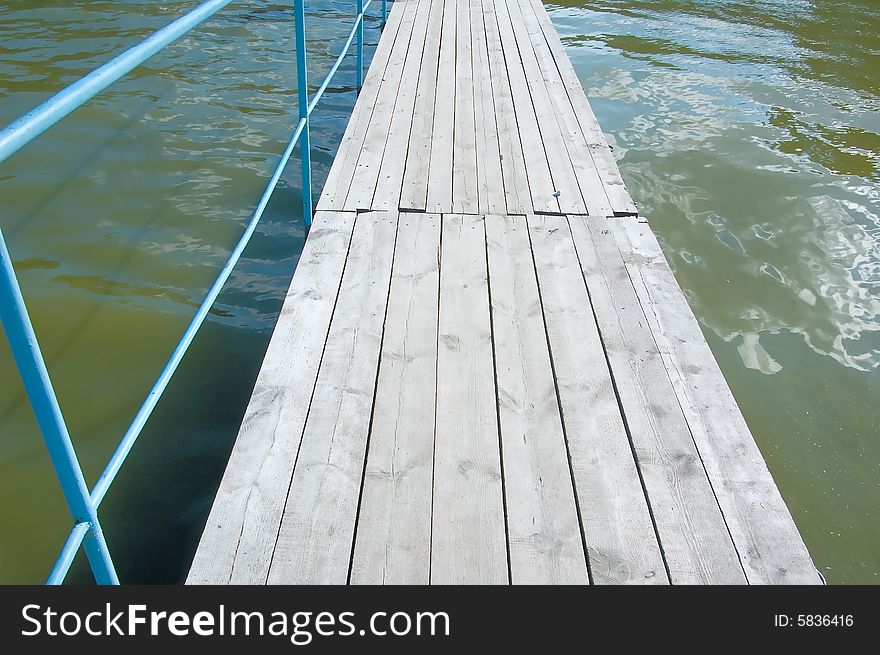 Photo of wooden footbridge over water