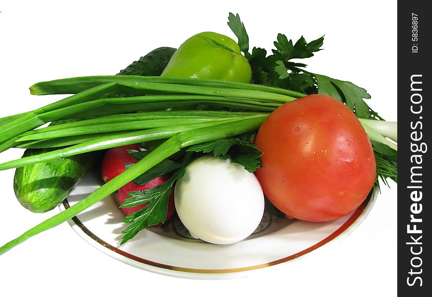 Vegetables and a hard-boiled egg on a plate. Vegetables and a hard-boiled egg on a plate