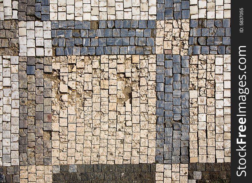 Stone design in Prague sidewalk. Background texture.