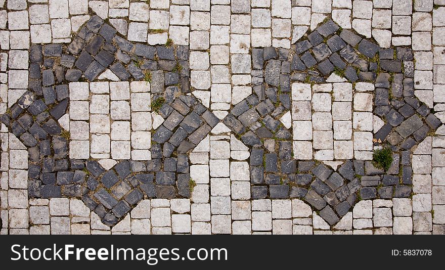 Prague sidewalk with star symbol. Background texture.