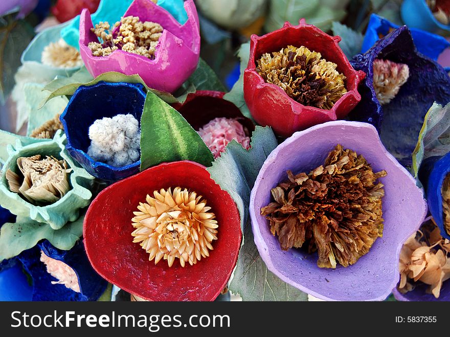 Creative bouquet of dried weeds in painted gourd pods. Creative bouquet of dried weeds in painted gourd pods.