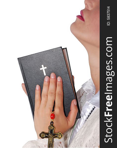 Woman praying with a bible in hands isolated on white background,check also Religion. Woman praying with a bible in hands isolated on white background,check also Religion