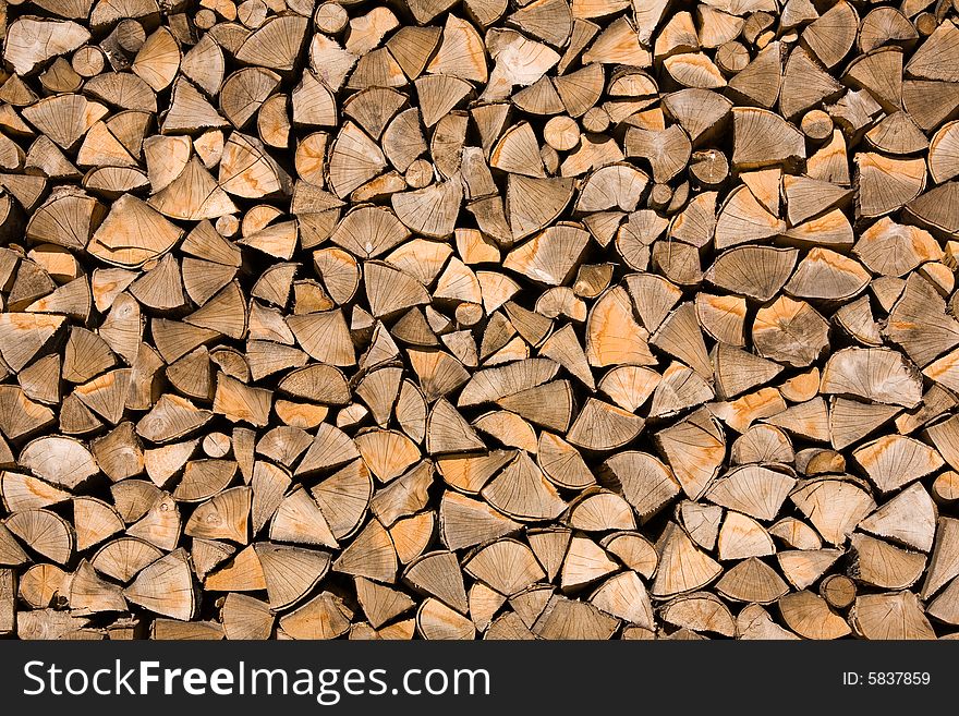 Stored wood chunks. Background texture.