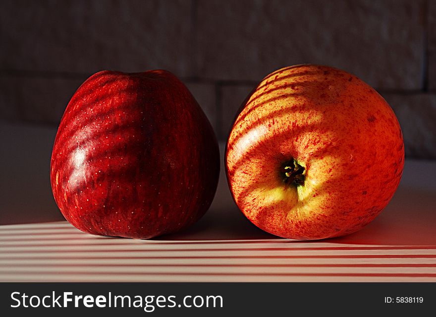 Two apples on a sunlight