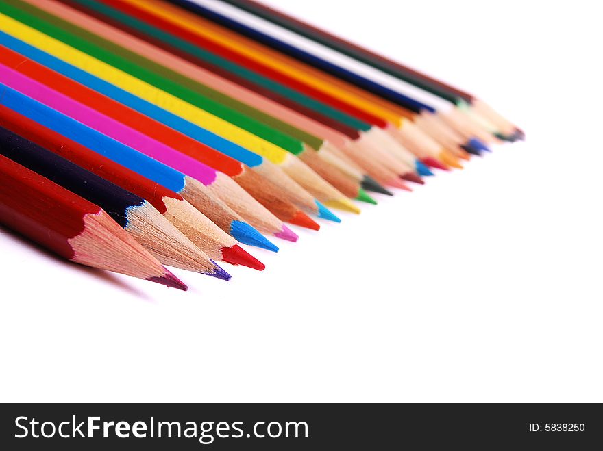 Many colorful pencils isolated on white background