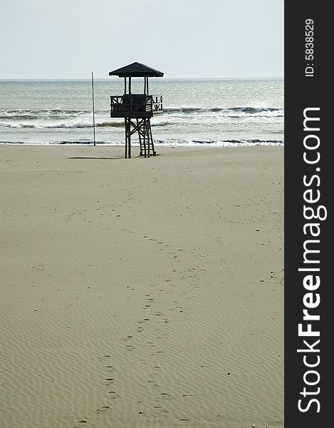 Beach detail with lifeguard cabin.