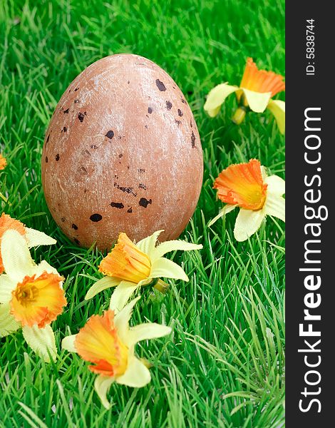 Easter decoration on green grass with flowers. Easter decoration on green grass with flowers