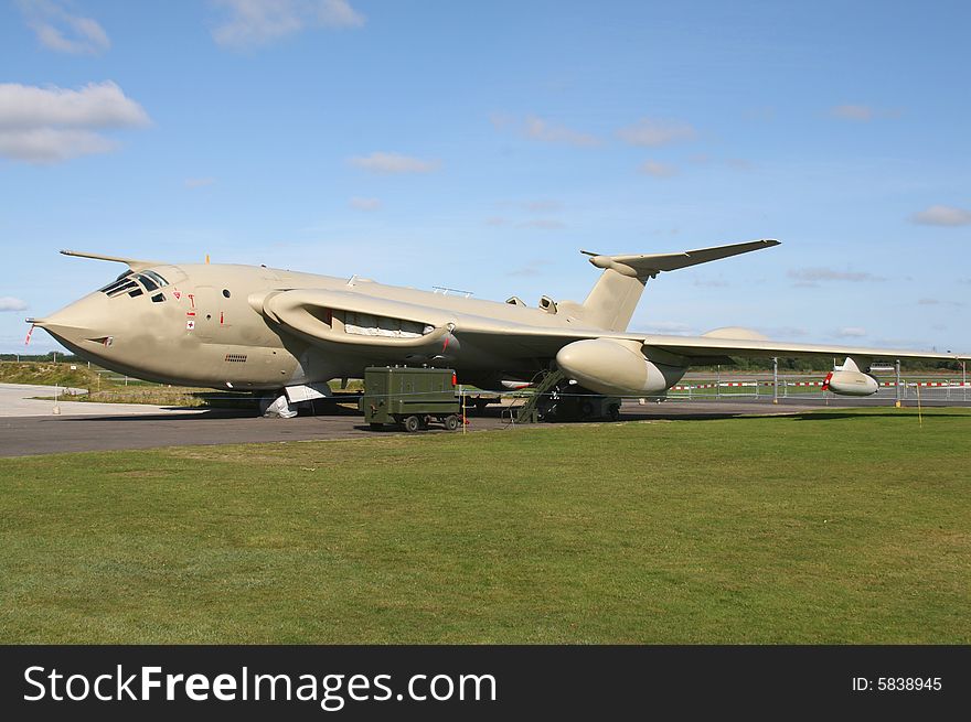 Victor bomber on ground with grass in foreground and blue sky in background