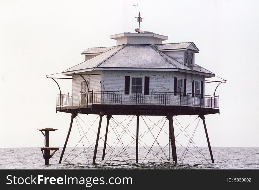Photo of a lighthouse in the middle of Mobile Bay.