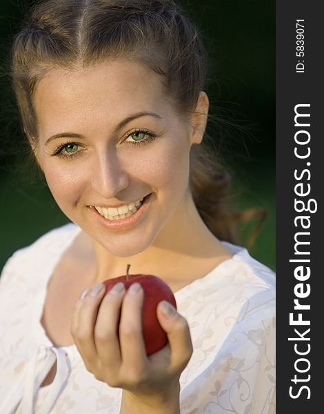Smilling woman with red apple. Smilling woman with red apple