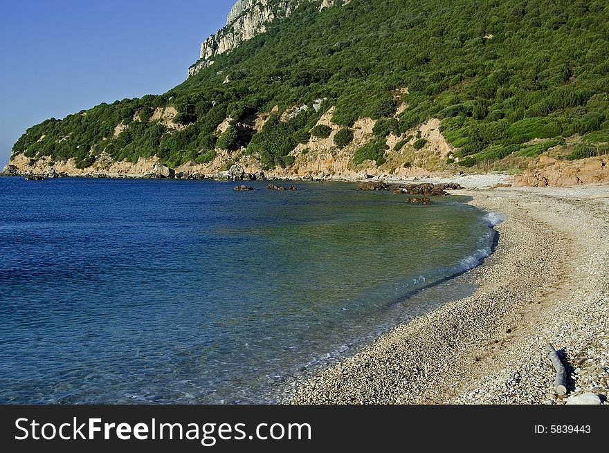 View of a Tavolara beach at 18:00 in summer. View of a Tavolara beach at 18:00 in summer.