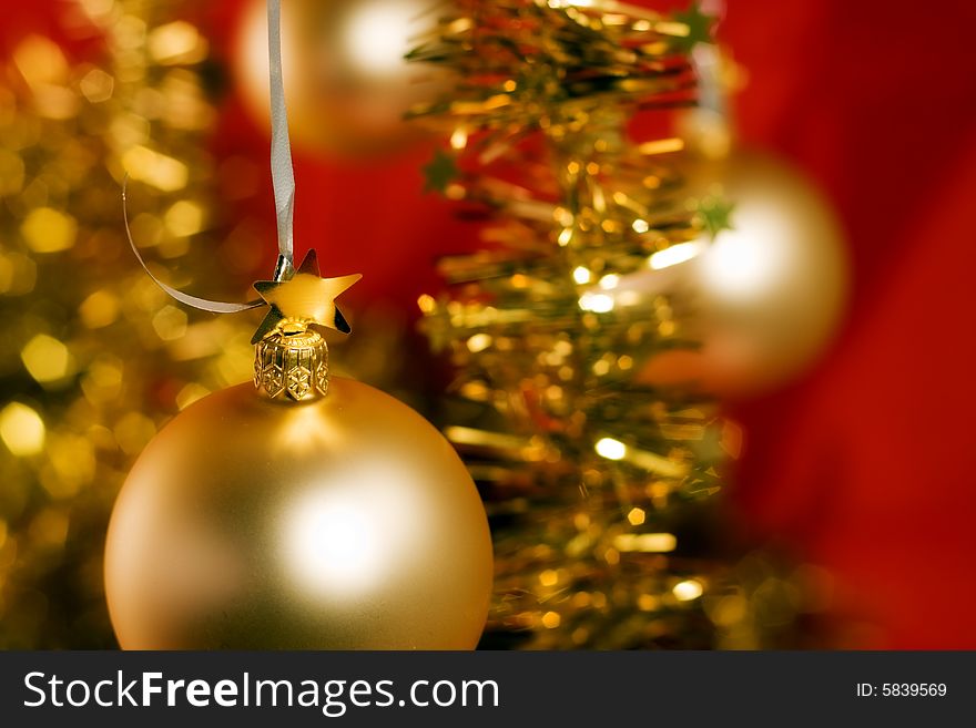 Red christmas ornament and golden stars. Red christmas ornament and golden stars