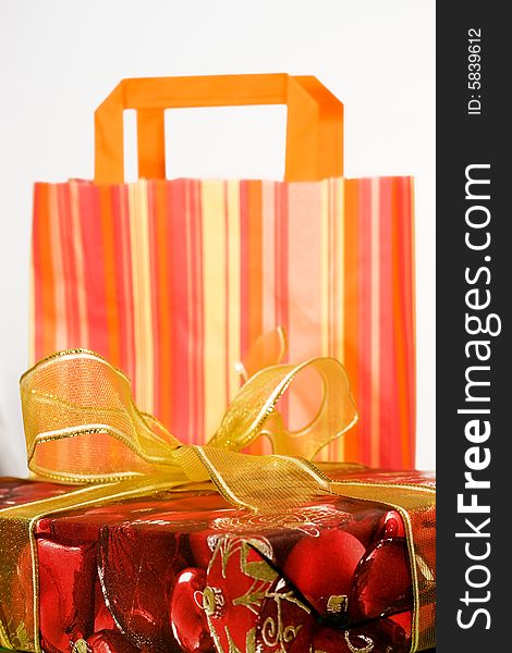 Red gift box with golden ribbon and paper bag. Red gift box with golden ribbon and paper bag