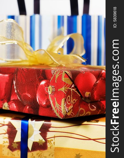 Red gift box with golden ribbon and paper bags. Red gift box with golden ribbon and paper bags