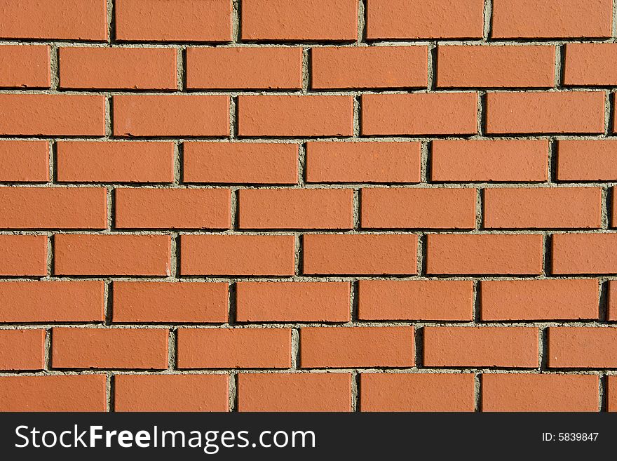 Modern brick wall background shot in direct sunlight