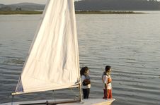 Free Man And Woman Next To Sailboat - Horizontal Stock Photo - 5842200