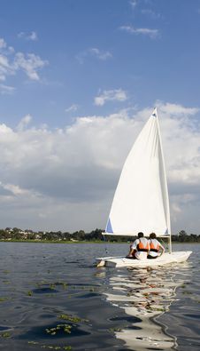 Free Man And Woman Sailing On Lake - Vertical Royalty Free Stock Photos - 5842348