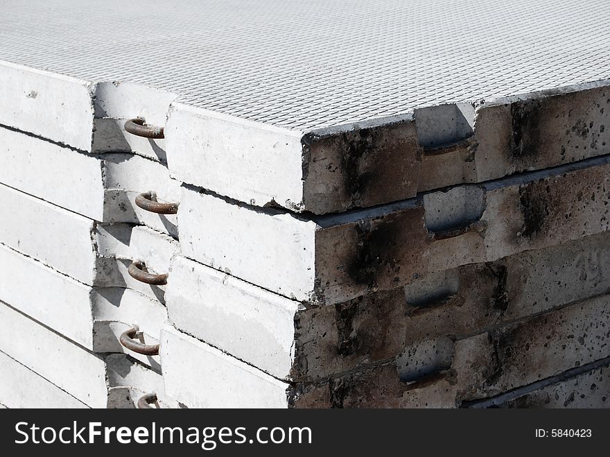 The grey ferro-concrete building blocks combined by a pile. The grey ferro-concrete building blocks combined by a pile.
